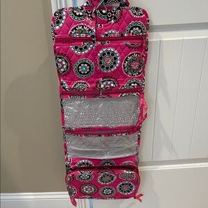 Vera Bradley toiletry case
Hanging, 5 pockets with tie closure and handles